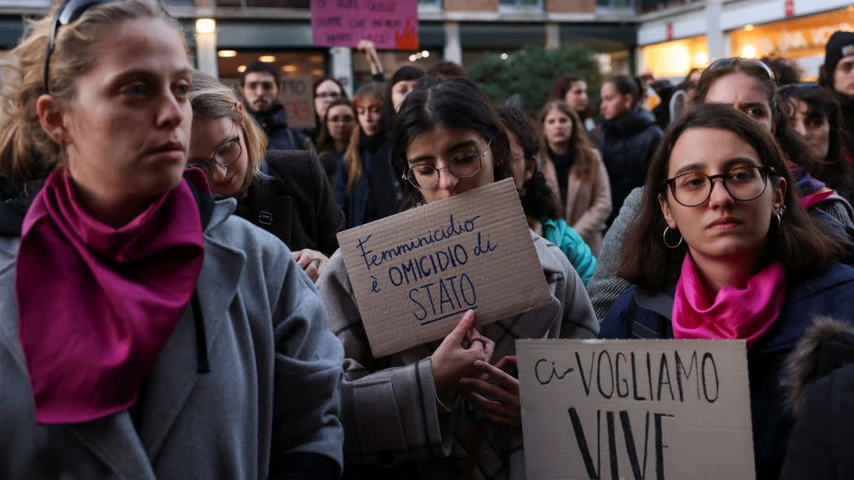 Students hold banners reading "Femicide is a state murder" and "We want us alive" outside the university of Milan on November 22, following 22-years-old Giulia Cecchettin's murder. - Claudia Greco/Reuters