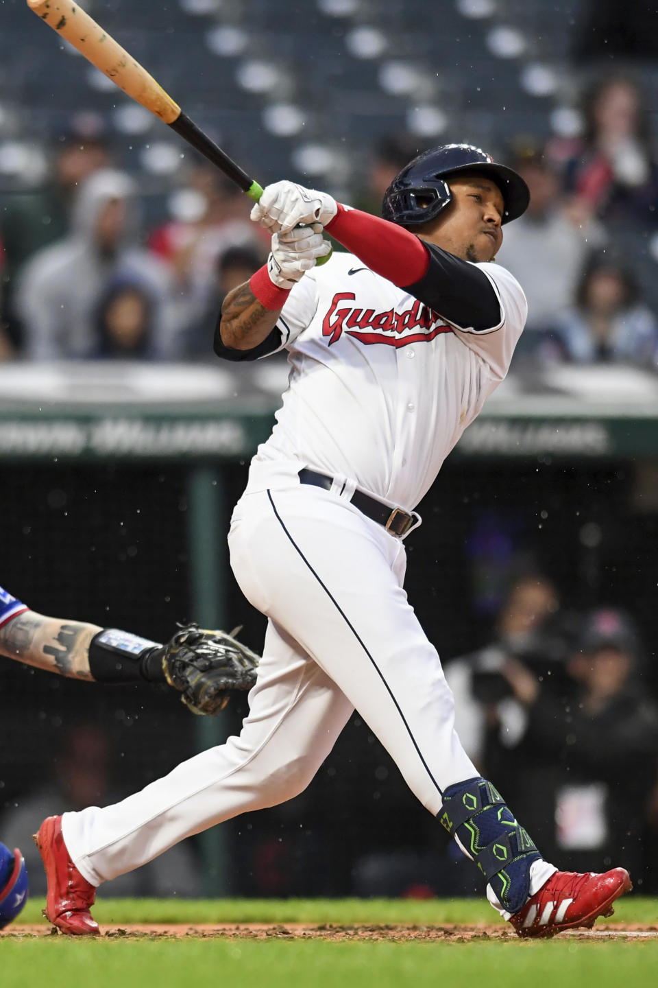 Cleveland Guardians' José Ramírez watches his RBI double against the Texas Rangers during the third inning of a baseball game, Wednesday, June 8, 2022, in Cleveland. (AP Photo/Nick Cammett)