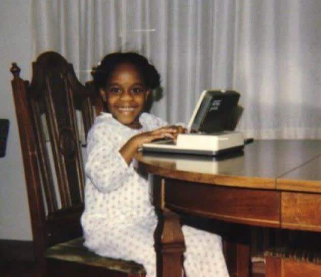 The author at 4 years old with her Whiz Kid computer. 