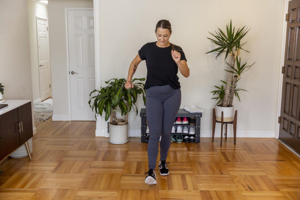 Woman doing a walking workout indoors