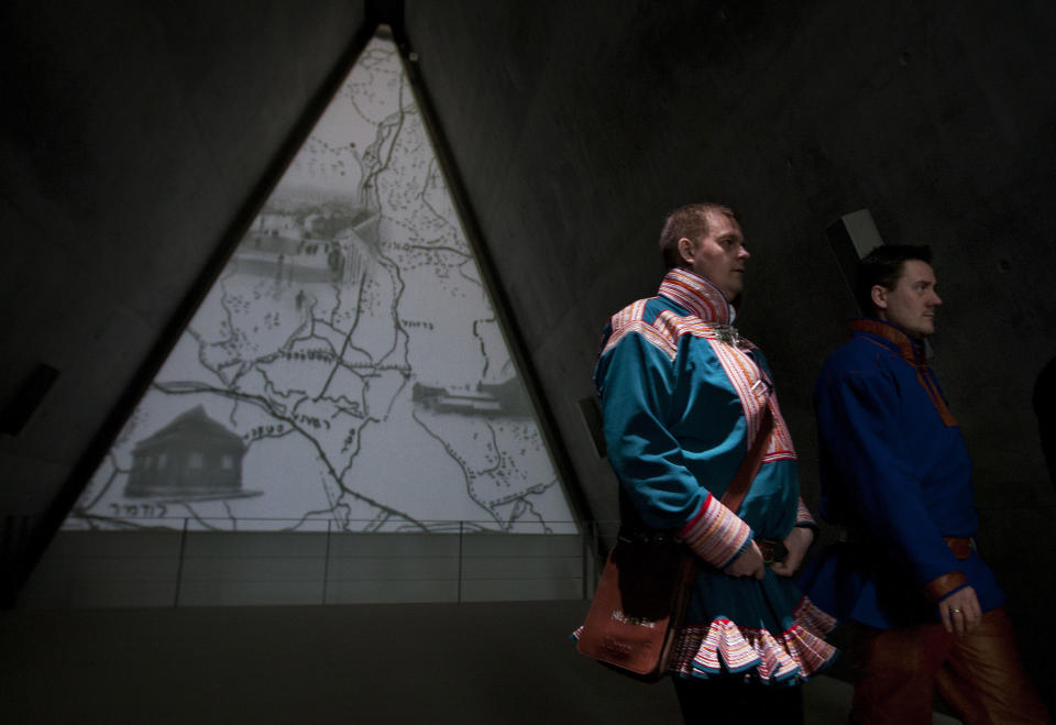 In this photo taken Tuesday, Feb. 21, 2012, Nils Ante Eira, center right, and Lars Joar Halonen, Sami of Norway, visit the Yad Vashem Holocaust memorial in Jerusalem, as part of their stay in Israel, viewed by many as a model for reviving ancient tongues. A delegation of Norway's indigenous Sami people visited Israel to seek help in preserving and expanding their fading native language. According to a senior researcher at the Academy of Hebrew Language the Sami are not the first foreigners to look to Israel for language instruction tips; visitors from the Maori tribes of New Zealand, from Wales and from the Basque region of Spain have come before. (AP Photo/Sebastian Scheiner)