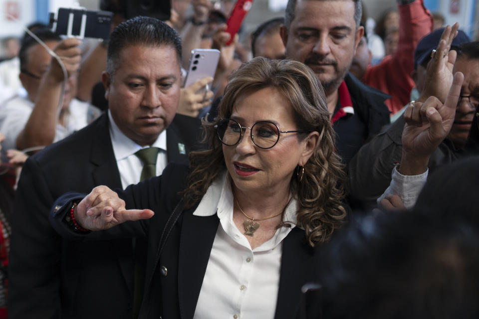 Sandra Torres, presidential candidate with the UNE party, shows her finger dyed with electoral ink after voting in the run-off presidential election in Guatemala City, Sunday, Aug. 20, 2023. (AP Photo/Santiago Billy)