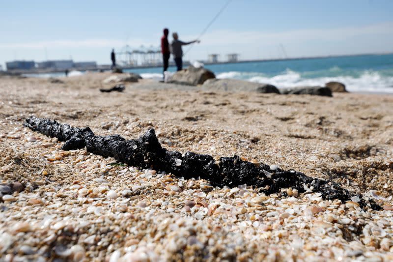 FILE PHOTO: Israel's beaches blackened by tar after offshore oil spill