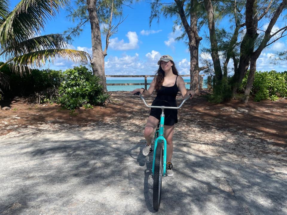 Reporter Amanda Krause rides a bike on Disney's private island in the Bahamas.