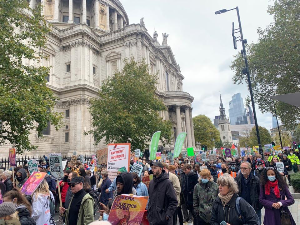 Activists march in front of St Paul’s Cathedral. (Emily Atkinson/ The Independent)