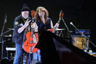 Canadian rock legend Randy Bachman, holding his reunited Gretsch guitar, poses with Japanese musician, TAKESHI during the Lost and Found Guitar Exchange Ceremony Friday, July 1, 2022, at Canadian Embassy in Tokyo. Bachman’s long-held dream came true Friday when he was reunited in Tokyo with a beloved guitar nearly a half-century after it was stolen from a Toronto hotel. Bachman, 78, a former member of The Guess Who, received the guitar from a Japanese musician who had bought it at a Tokyo store in 2014 without knowing its history. (AP Photo/Eugene Hoshiko)