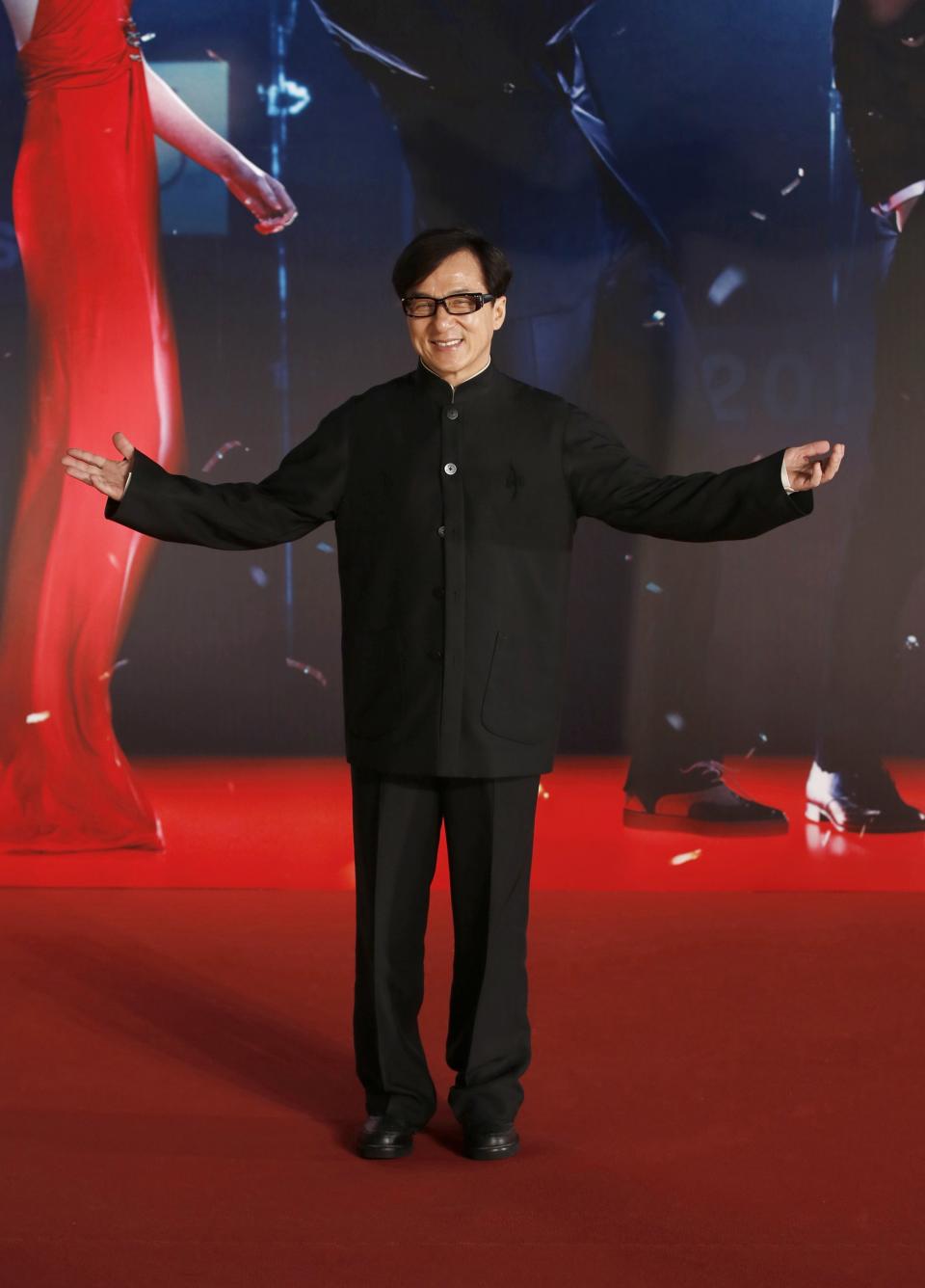 Hong Kong actor Jackie Chan poses on red carpet at Hong Kong Film Awards