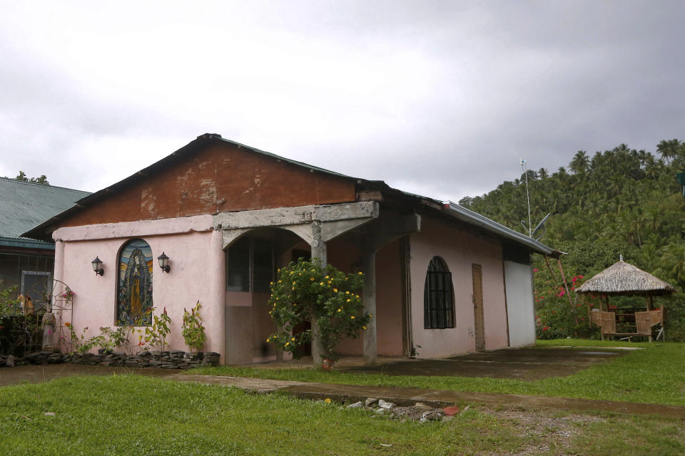 This Jan. 26, 2019 photo shows the convent next to the chapel built by American priest Father Pius Hendricks in the village of Talustusan on Biliran Island in the central Philippines. Since December 2018, the small village has been rocked by controversy after about 20 boys and men accused the Catholic parish priest of years of alleged sexual abuse. (AP Photo/Bullit Marquez)