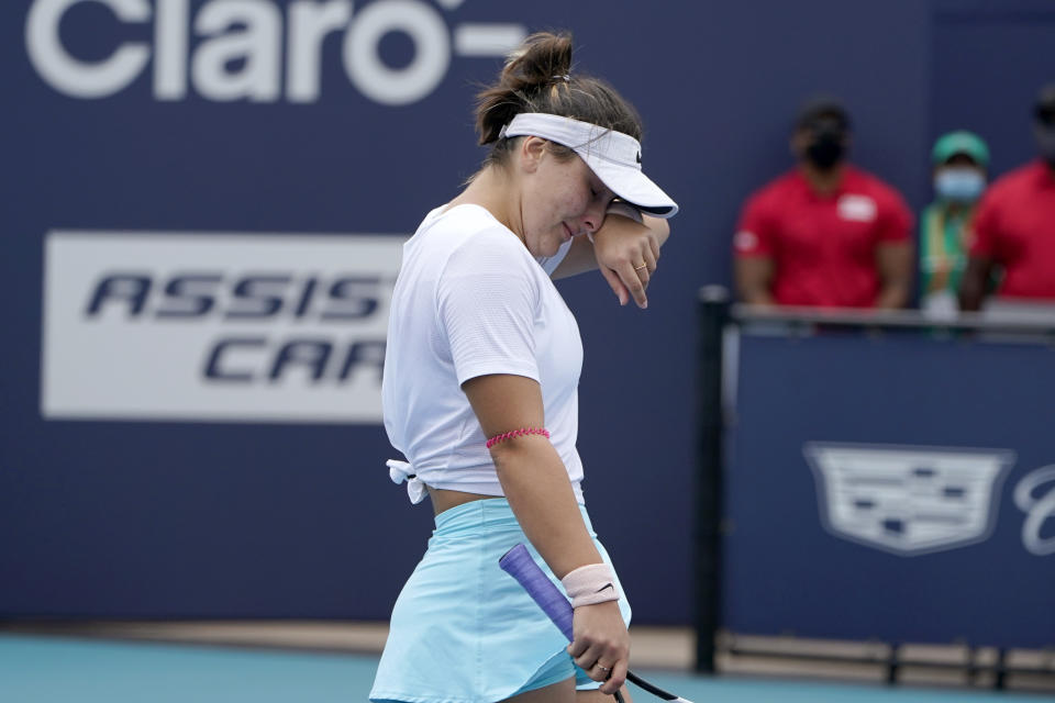 Bianca Andreescu of Canada walks off the court as she retired during her finals match against Ashleigh Barty of Australia at the Miami Open tennis tournament, Saturday, April 3, 2021, in Miami Gardens, Fla. Barty won 6-3, 4-0, as Andreescu retired due to injury. (AP Photo/Lynne Sladky)