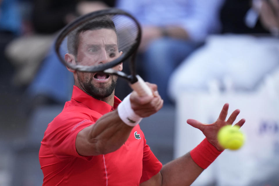 Serbia's Novak Djokovic returns the ball to France's Corentin Moutet at the Italian Open tennis tournament in Rome, Friday, May 10, 2024. (AP Photo/Alessandra Tarantino)