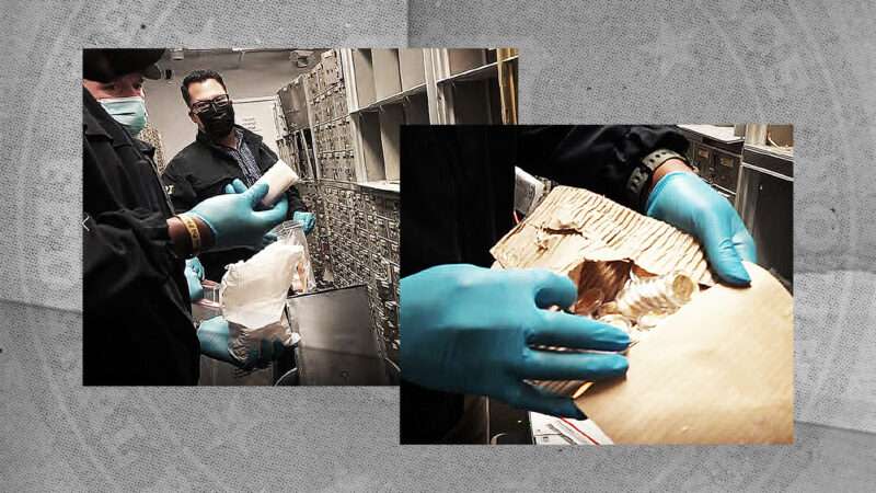 FBI agents search through safe deposit boxes seized in the March 2021 raid of U.S. Private Vaults.