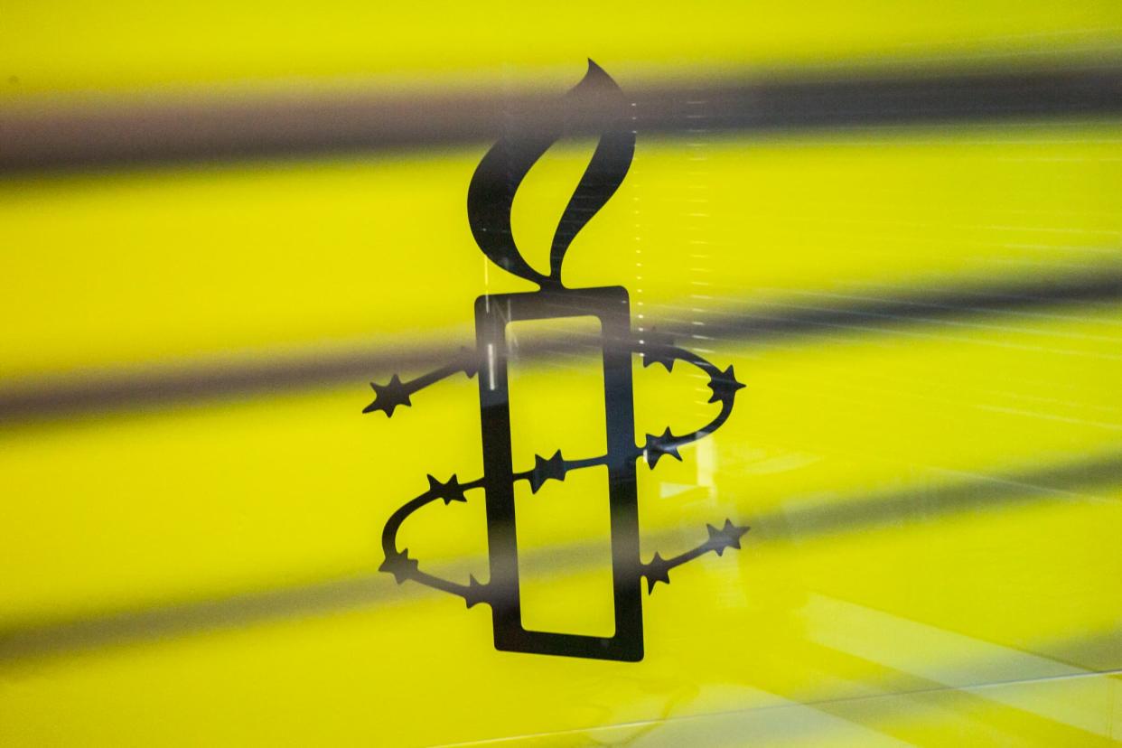 Le logo d'Amnesty International photographié en 2021 dans les locaux de Hong Kong (Illustration) - ISAAC LAWRENCE / AFP