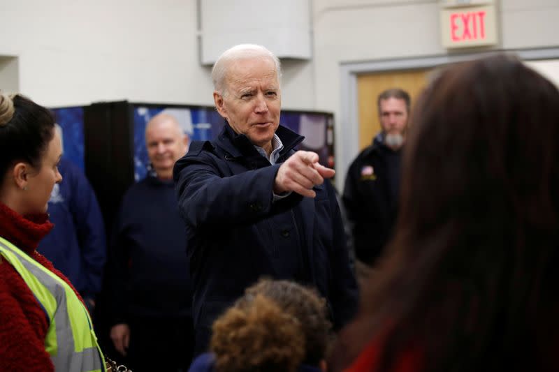 Democratic 2020 U.S. presidential candidate and former Vice President Joe Biden chats with school bus drivers during a visit at a bus garage while campaigning in Nashua, New Hampshire U.S.