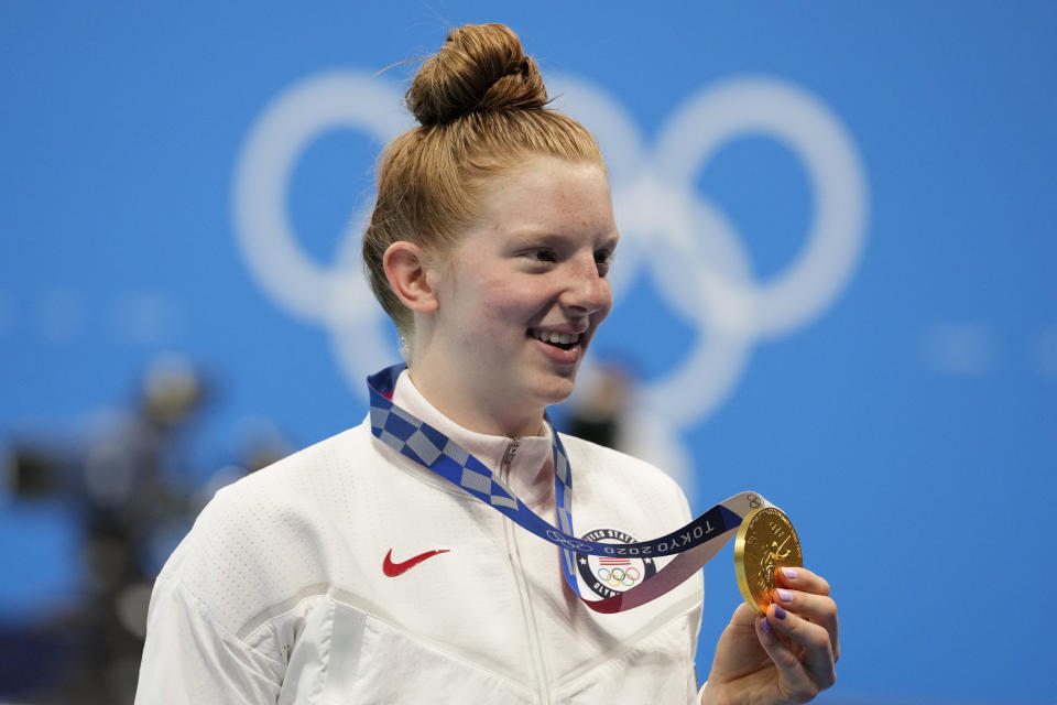 Lydia Jacoby, of the United States, poses with the gold medal after winning the final of the women's 100-meter breaststrokeat the 2020 Summer Olympics, Tuesday, July 27, 2021, in Tokyo, Japan. (AP Photo/Petr David Josek)