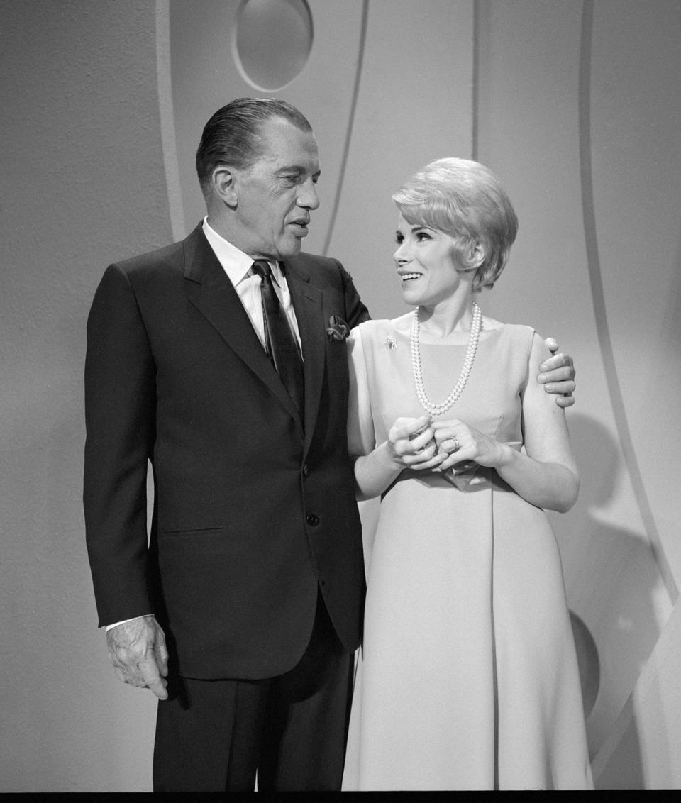 American talk show host Ed Sullivan puts his arm around Joan Rivers as they chat on "The Ed Sullivan Show," New York, New York, September 11, 1966. (CBS Photo Archive/Getty Images)