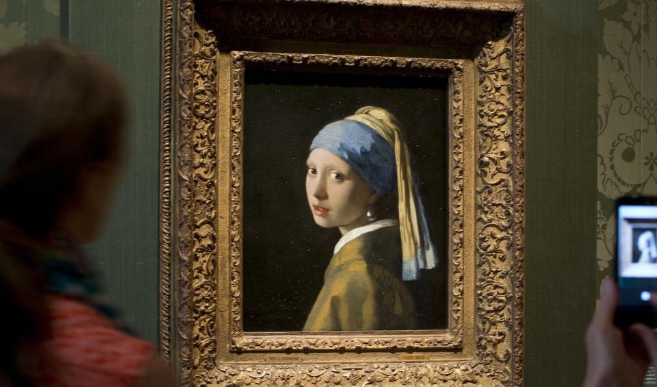 Johannes Vermeer’s ‘Girl with a Pearl Earring,’ c. 1665, was recently targeted by climate activists in a protest at the Mauritshuis museum in The Hague. (AP Photo/Peter Dejong)