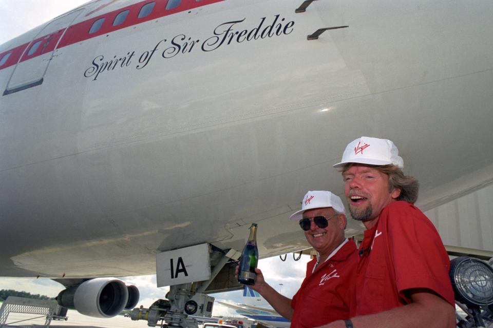 Sir Freddie Laker and Sir Richard Branson celebrate the christening of a Boeing 747 named "Spirit of Sir Freddie" in honor of Laker in 1992.