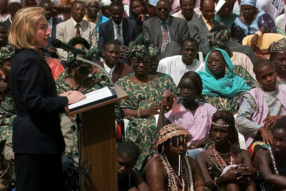 FILE - Then-first lady Hillary Clinton speaks to students and parents of the Martin Luther King Jr. School, an all girls school, in Dakar Senegal, March 17, 1997. (AP Photo/Doug Mills, File)