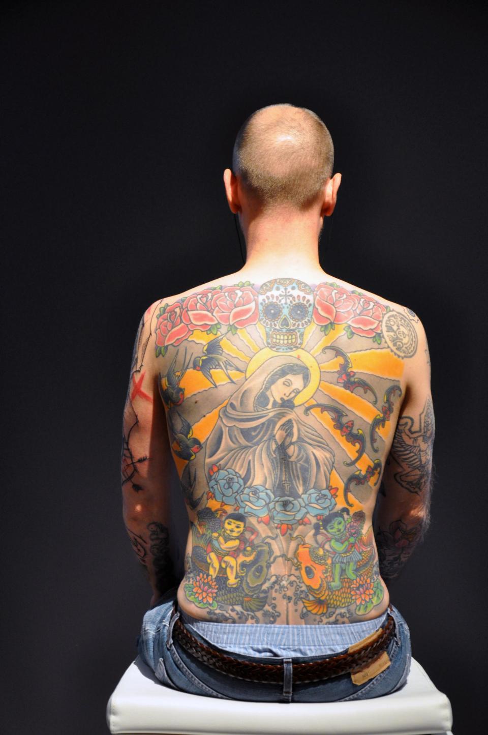 <b><p>Tim</p></b> Tattooed Tim is Wim Delvoye's living work of art. Delvoye actually sold Tim's skin. So, one day, when Tim dies, his skin will be removed and it will belong to the person who paid for it. What do you think of this? Does this qualify as art or does it demean and objectify a human being?