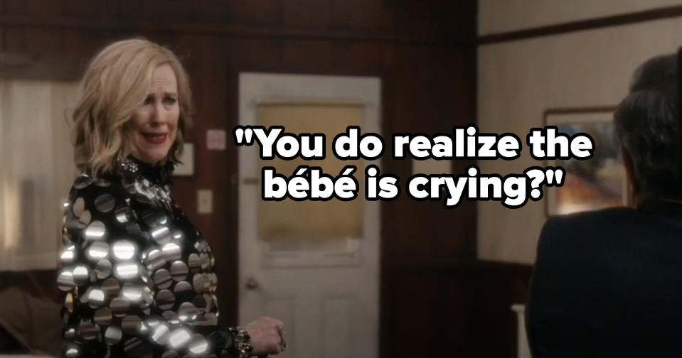 Moira saying, "You do realize the bebe is crying?"