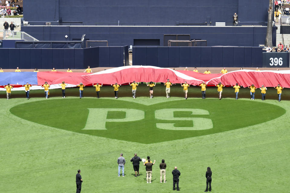 A heart shaped pattern is seen on the field in memory of former San Diego Padres owner Peter Seidler before an opening day baseball game between the San Francisco Giants and the San Diego Padres, Thursday, March 28, 2024, in San Diego. (AP Photo/Denis Poroy)