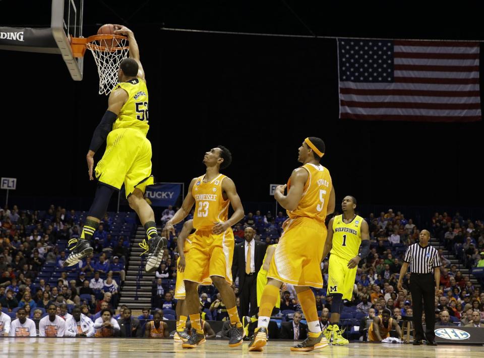 Michigan's Jordan Morgan dunks during the first half of an NCAA Midwest Regional semifinal college basketball tournament game against the Tennessee Friday, March 28, 2014, in Indianapolis. (AP Photo/David J. Phillip)