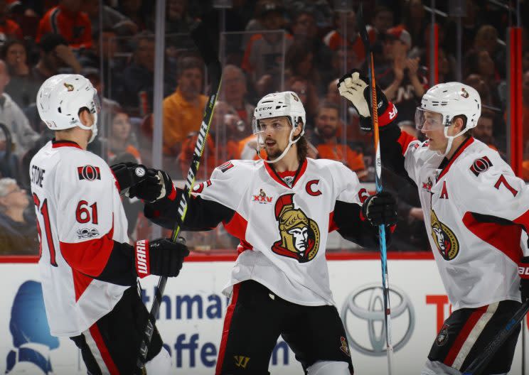 Erik Karlsson (middle) of the Ottawa Senators celebrates his first period goal against the Philadelphia Flyers at the Wells Fargo Center on March 28, 2017. (Photo by Bruce Bennett/Getty Images)