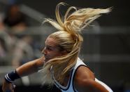 Dominika Cibulkova of Slovakia serves to Tsvetana Pironkova of Bulgaria during their women's singles second round match at the Australian Open 2015 tennis tournament in Melbourne January 22, 2015. REUTERS/Thomas Peter (AUSTRALIA - Tags: SPORT TENNIS)