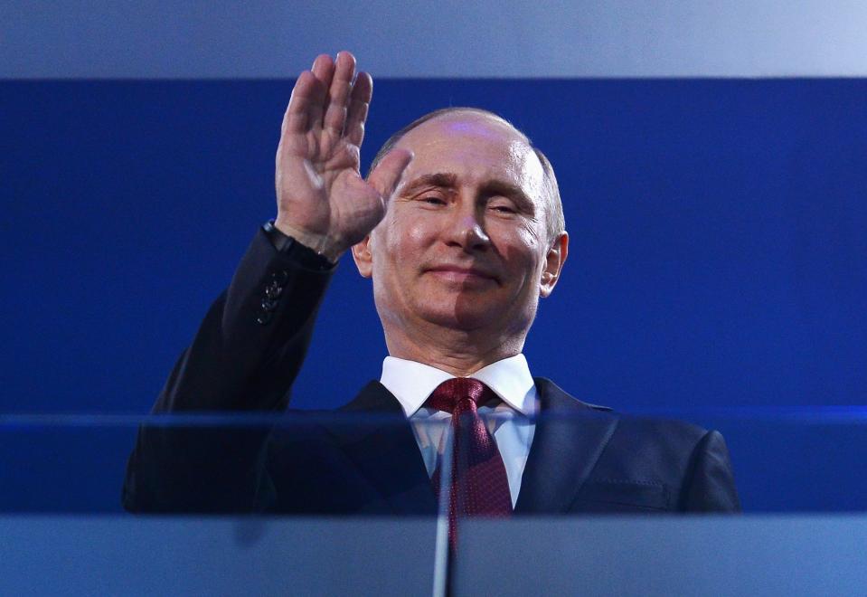 Russia President Vladimir Putin waves.