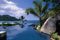 Banyan Tree Seychelles, Seychelles. The invitingly dark-tiled main pool at Banyan Tree Seychelles juts out into the Indian Ocean like a shimmering black mirror. Swim up to the edge and peer down at the waves as they crash onto the beach. (www.banyantree.com/en/seychelles)