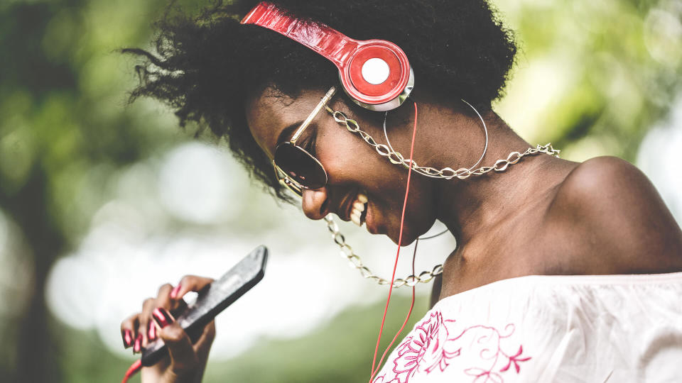 woman listening to Spotify music with headphones