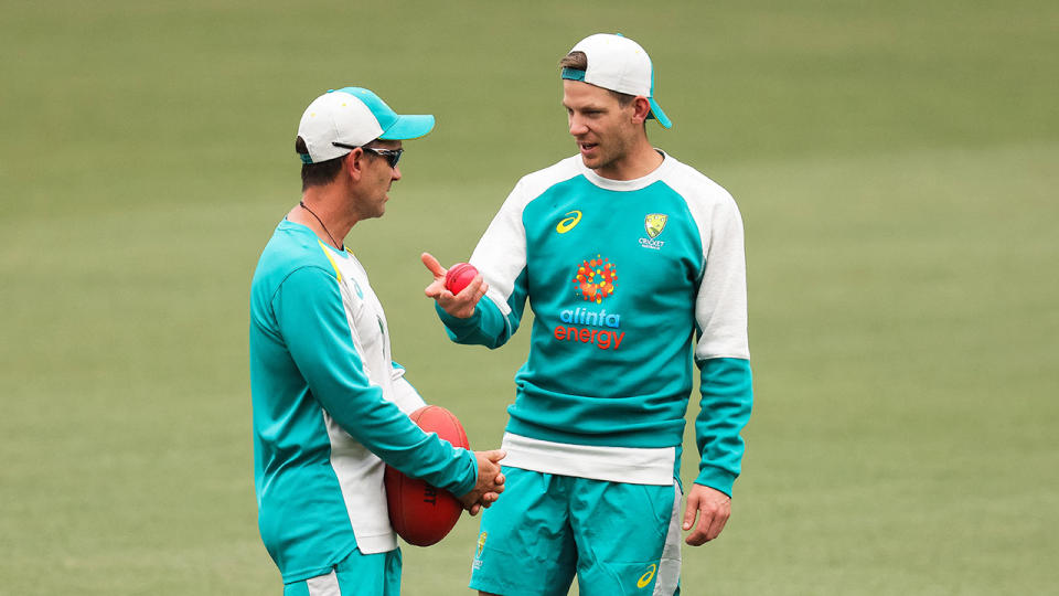 Australia captain Tim Paine can be seen here chatting to coach Justin Langer.