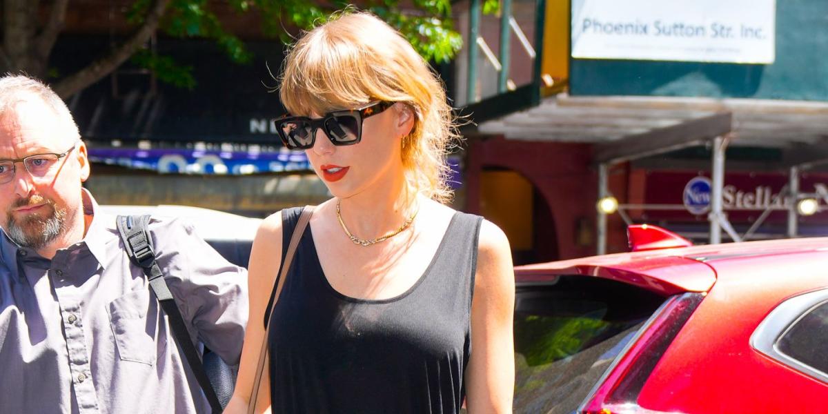 Taylor Swift Channels Her 1989 Era in a Belted Black Maxi Dress