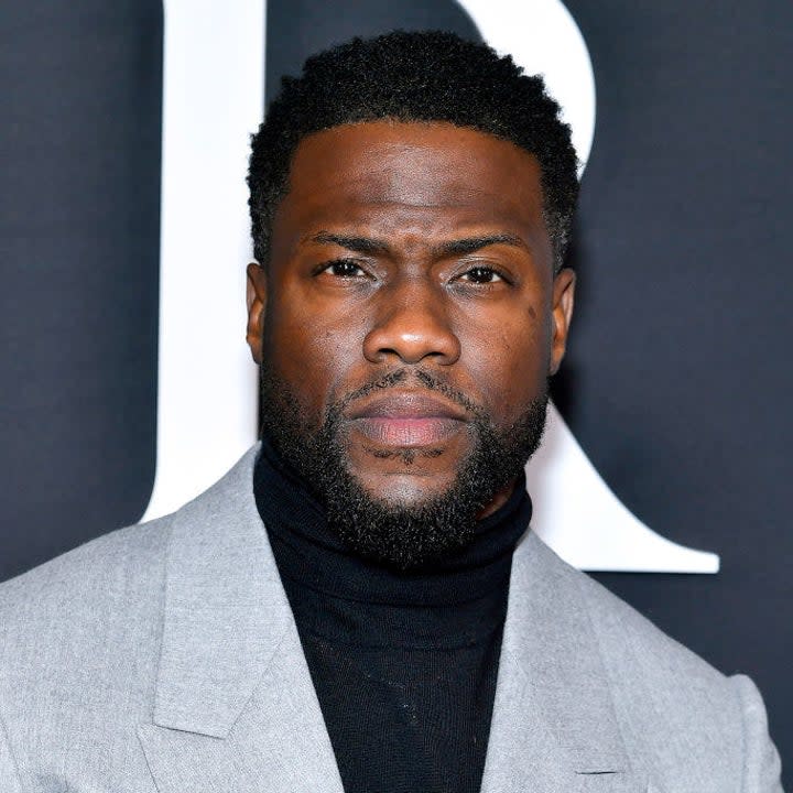 Kevin Hart in a suit at a red carpet event