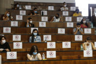 Students sit at a distance as a precaution against COVID-19, as they undergo an aptitude test to access the University of Medicine, in Rome Thursday, Sept. 3, 2020. (Cecilia Fabiano/LaPresse via AP)