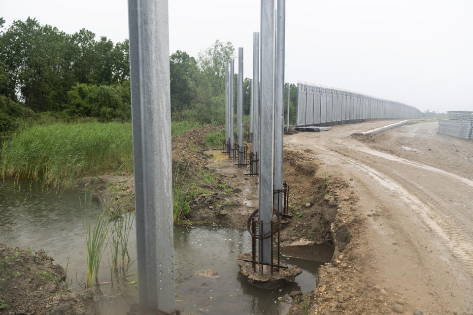 A view of a steel wall at Evros river, near the village of Poros, at the Greek -Turkish border, Greece, Friday, May 21, 2021. An automated hi-tech surveillance network being built on the Greek-Turkish border aiming at detecting migrants early and deterring them from crossing, with river and land patrols using searchlights and long-range acoustic devices. (AP Photo/Giannis Papanikos)