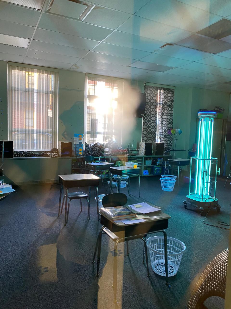 An ADIBOT sanitizes a Christina classroom, using UV-C light to disinfect surfaces and the air.