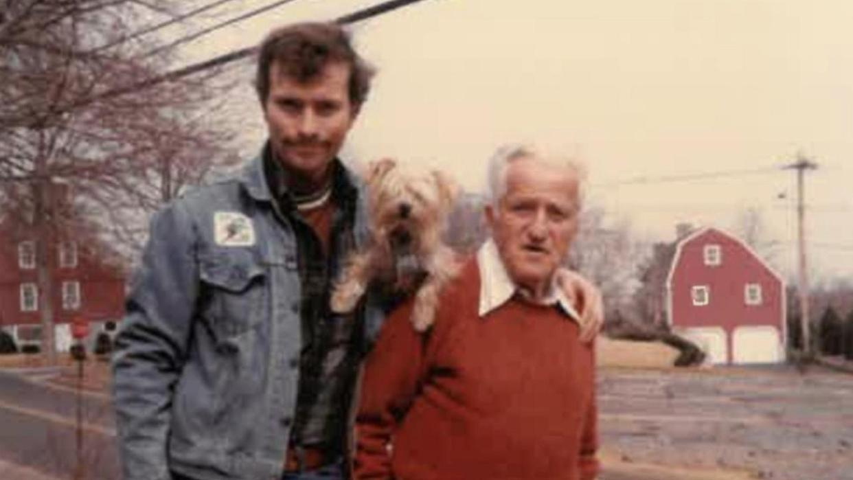 Hadden Clark with his father and their yorkie.