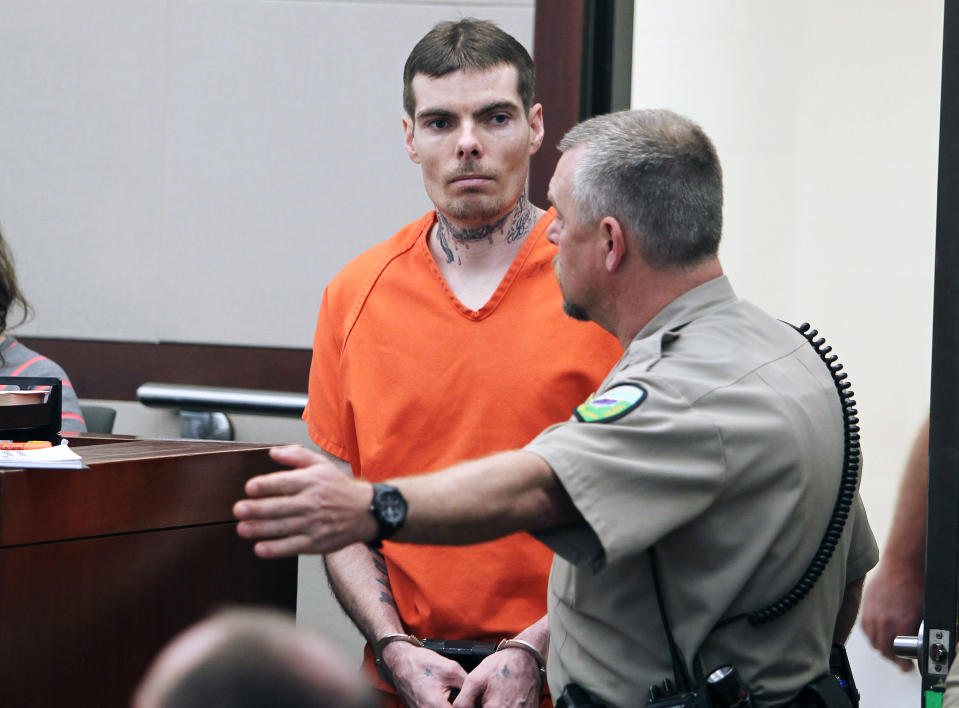 Charles Richard Jennings Jr., left, is lead into the courtroom for his sentencing at Second District Court in Ogden, Utah, Thursday, Feb. 20, 2014. Jennings, charged with shooting his wife's father during a Father's Day Mass, has been sentenced to four years to life in prison. He took a plea deal in November, pleading guilty and mentally ill to charges of attempted murder and aggravated burglary. He also acknowledged a firearms violation. (AP Photo/Standard-Examiner, Brian Nicholson, Pool)