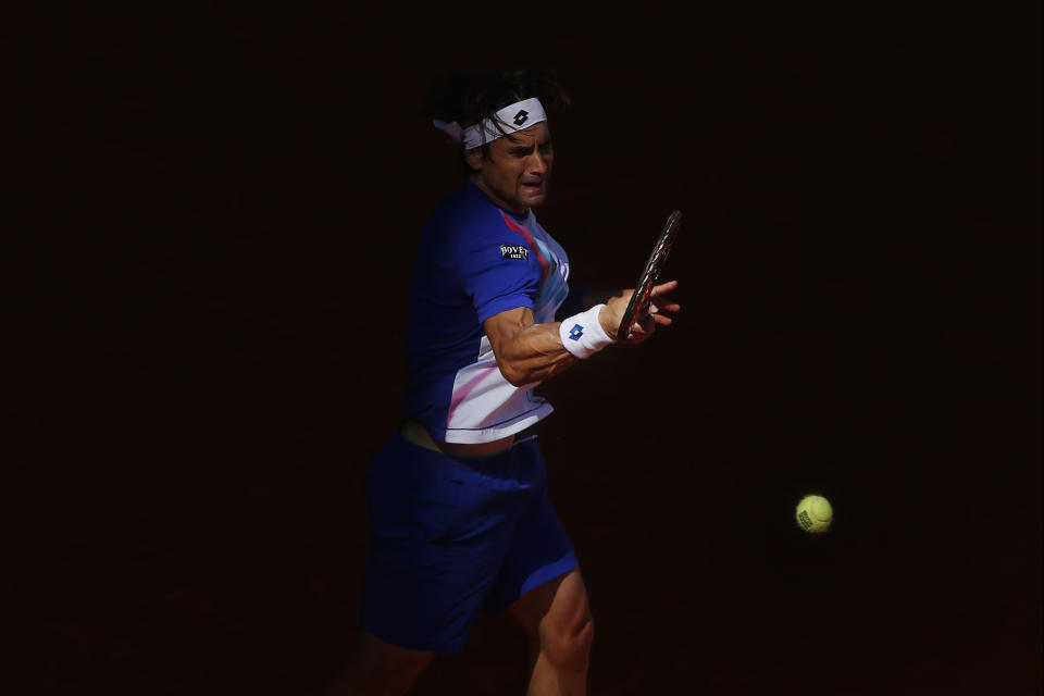 David Ferrer from Spain returns the ball during a Madrid Open tennis tournament match against Albert Ramos from Spain, in Madrid, Spain, Tuesday, May 6, 2014. (AP Photo/Andres Kudacki)