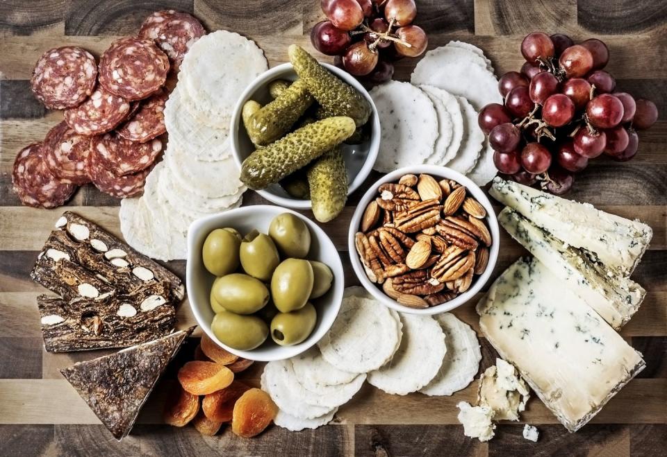 Assemble a fancy charcuterie board.