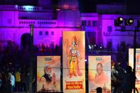 Banners with the images of (L-R) Indian Prime Minister Narendra Modi, Lord Ram and Chief Minister of Uttar Pradesh Yogi Adityanath are seen along the banks of the River Sarayu on the ever before the groundbreaking ceremony of the proposed Ram Temple in Ayodhya on August 4, 2020. - India's Prime Minister Narendra Modi will lay the foundation stone for a grand Hindu temple in a highly anticipated ceremony at a holy site that was bitterly contested by Muslims, officials said. The Supreme Court ruled in November 2019 that a temple could be built in Ayodhya, where Hindu zealots demolished a 460-year-old mosque in 1992. (Photo by SANJAY KANOJIA / AFP) (Photo by SANJAY KANOJIA/AFP via Getty Images)