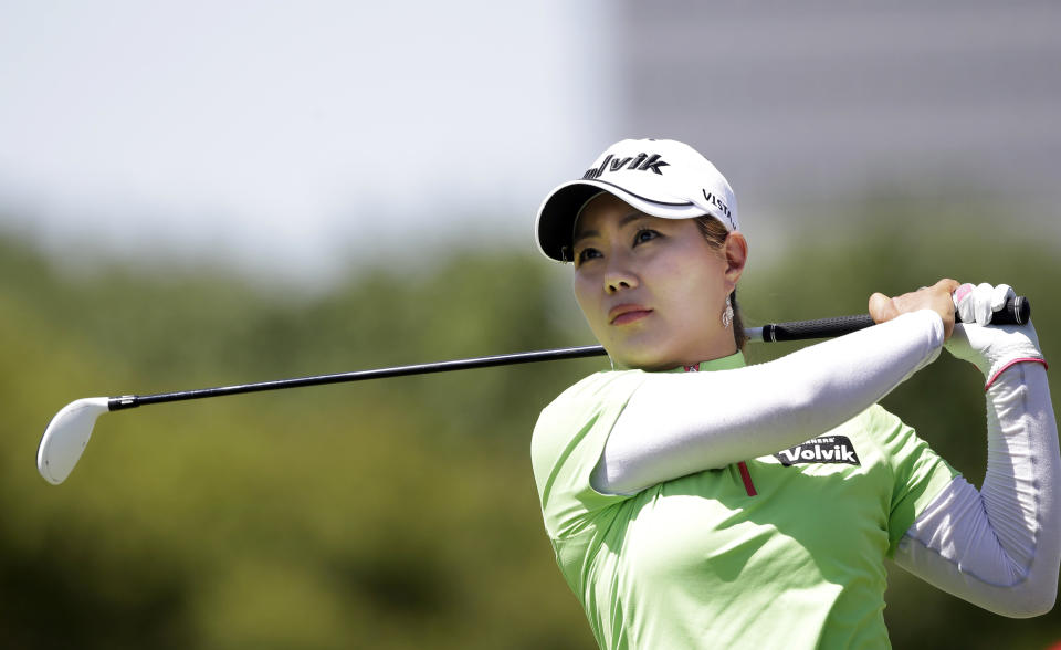 Meena Lee, of South Korea, watches her tee shot on the 11th hole during the third round of the North Texas LPGA Shootout golf tournament at the Las Colinas Country Club in Irving, Texas, Saturday, May 3, 2014. (AP Photo/LM Otero)