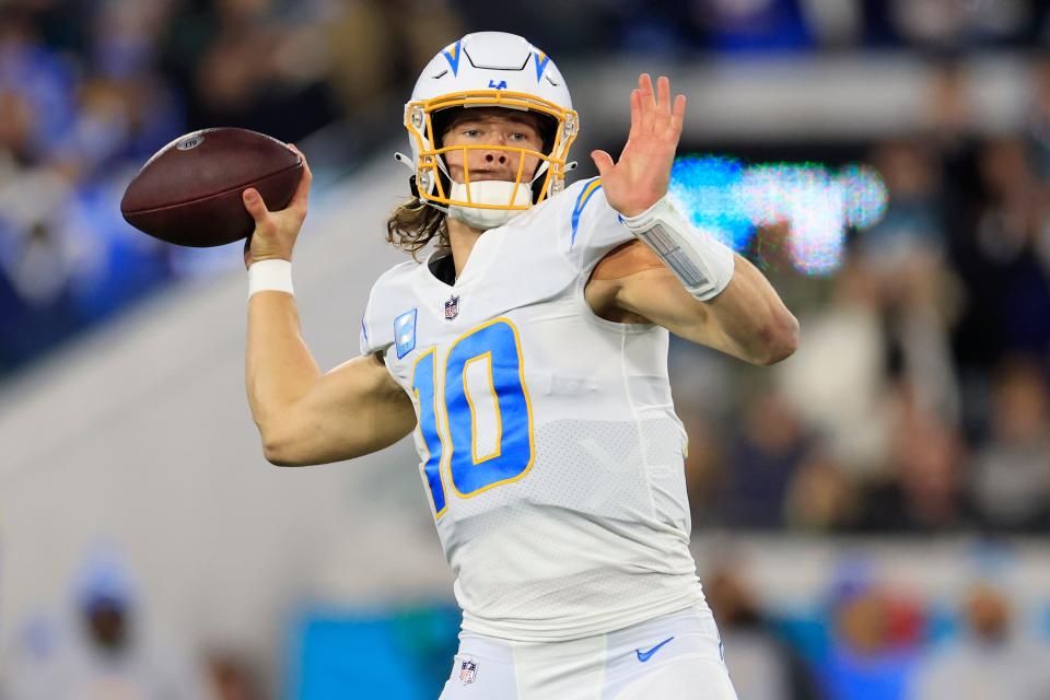 Los Angeles Chargers quarterback Justin Herbert looks to throw during an NFL playoff game against the Jacksonville Jaguars.