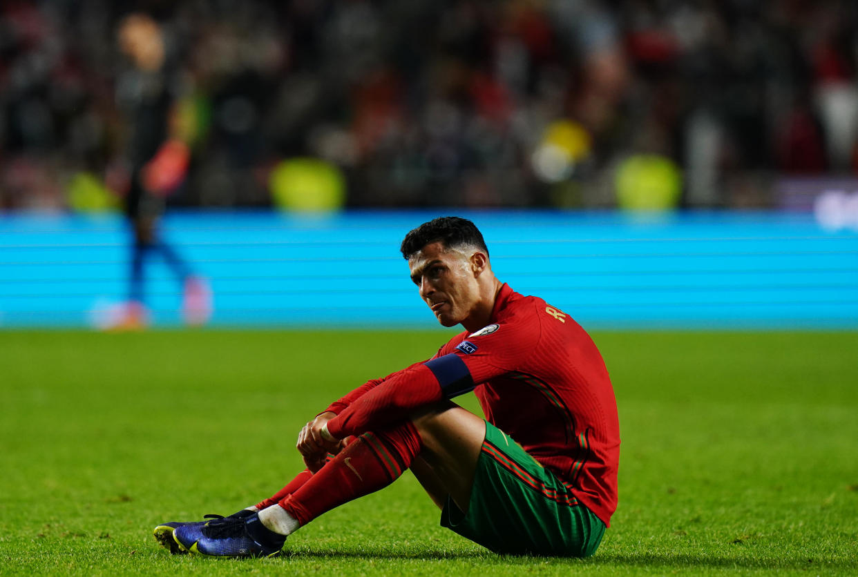 LISBON, PORTUGAL - NOVEMBER 14: Cristiano Ronaldo of Manchester United and Portugal reaction after losing the match at the end of the 2022 FIFA World Cup Qualifier match between Portugal and Serbia at Estadio da Luz on November 14, 2021 in Lisbon, Portugal.  (Photo by Gualter Fatia/Getty Images)