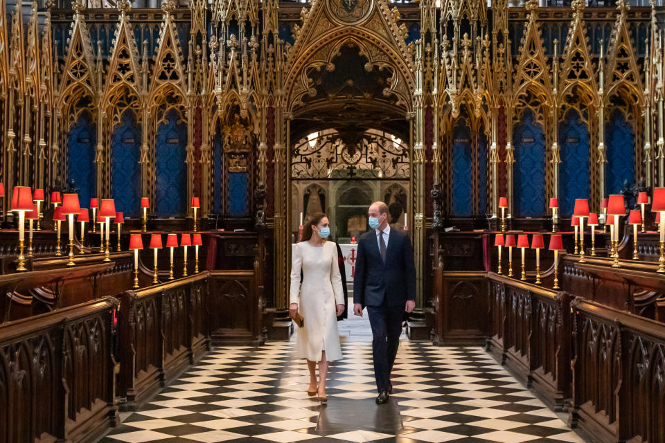 <p>William and Kate revisited Westminster Abbey in 2021, not long before their 10th wedding anniversary, and Kate's choice of a white outfit sparked memories of their wedding day. The couple were there to see how the church had been transformed into a vaccination hub. (PA Images)</p> 