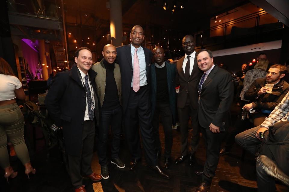 From left, Head of NBA Social Responsibility Todd Jacobson, former French national soccer team striker Thierry Henry, NBA Hall of Famer Dikembe Mutombo, British fashion designer Ozwald Boateng and Basketball Africa League President Amadou Gallo Fall join Harwich native Kent Christian at the 2017 NBA London Game in London.