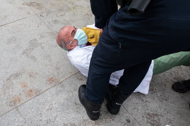 A climate protester in Madrid being grabbed by police. (Photo: Aldara Zarraoa via Getty Images)