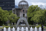 FILE - The Cenotaph for the Victims of the Atomic Bomb and the The Atomic Bomb Dome are seen at the Peace Memorial Park in Hiroshima on May 19, 2023. Hiroshima and Pearl Harbor, two symbols of World War II animosity between Japan and the United States, are now promoting peace and friendship through a sister park arrangement. U.S. Ambassador to Japan Rahm Emanuel and Hiroshima Mayor Kazumi Matsui signed a sister park agreement on Thursday, June 29, for Hiroshima’s Peace Memorial Park and the Pearl Harbor National Memorial of Hawaii. (Brendan Smialowski/Pool Photo via AP, File)