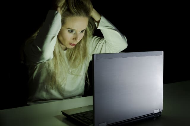 woman working on a computer by...